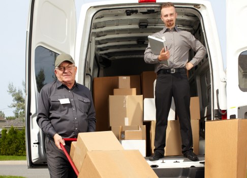 Technology and office furniture being prepared for an efficient business move in Bow