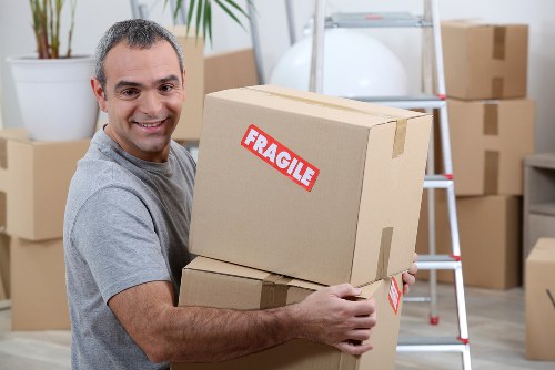 Business relocation planning in Bow with office boxes and moving equipment