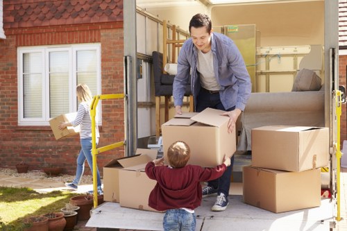 Professional same day removals team loading furniture in Bow