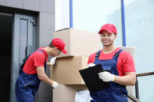 Removalcompanies Bow moving team preparing boxes and furniture for a local relocation