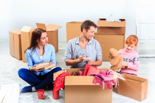 Moving boxes and furniture prepared for a Bow house removal