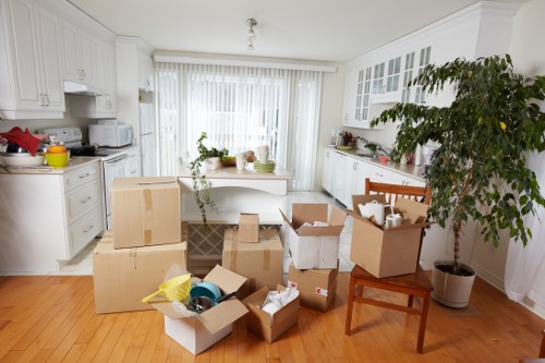 Local Bow removal company handling packed household items with care