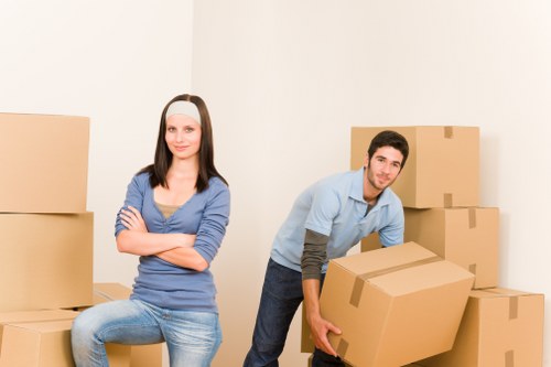 Removal team handling items carefully in an East London property