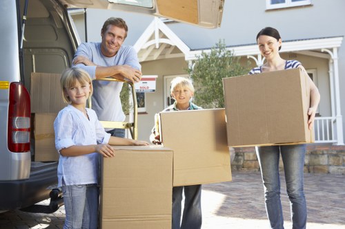 Packed boxes and furniture loaded into a removal truck