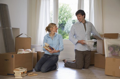 Planning a moving truck in Bow with boxes and furniture ready to load