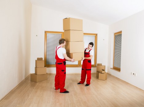 Loading furniture and boxes into a van for a Bow relocation