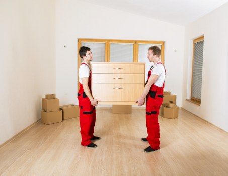 Movers handling furniture carefully during a house relocation